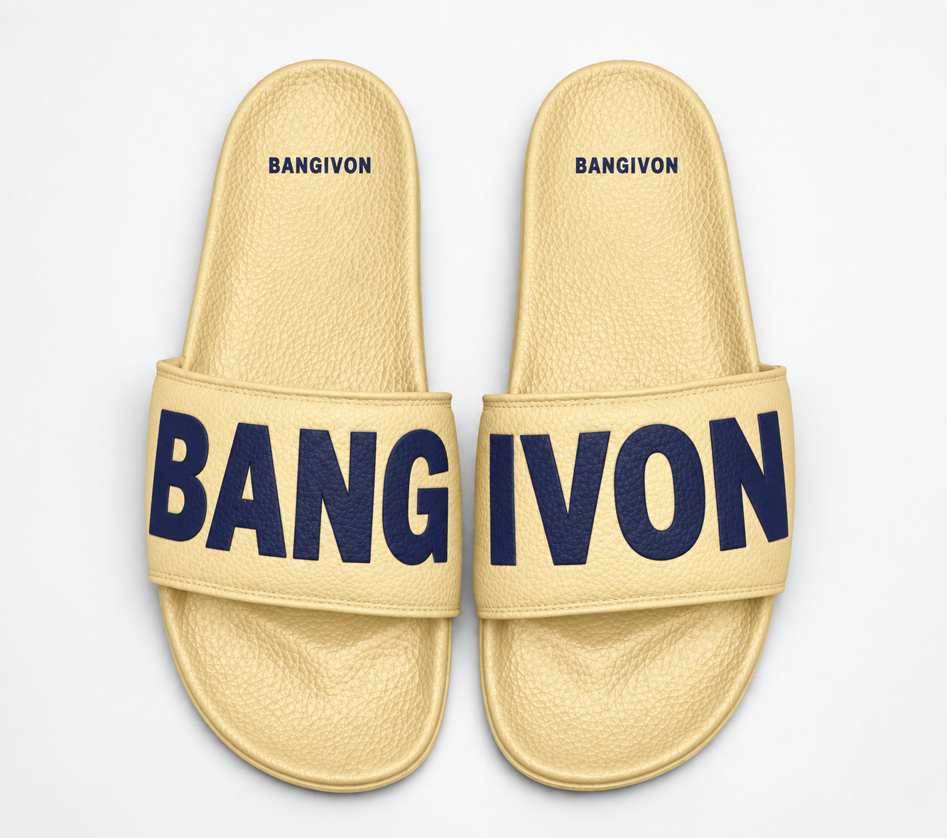 BANGIVON single-band slide sandals in Butter Yellow / Navy, with BANG and IVON block lettering across the pair