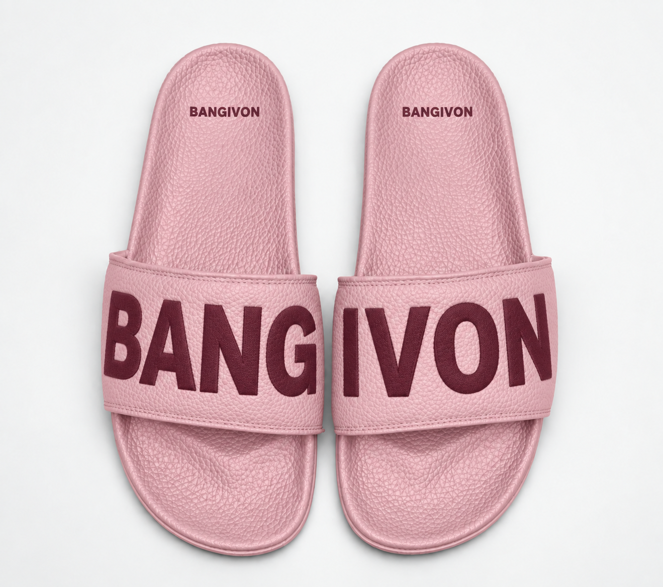 BANGIVON single-band slide sandals in Blush Pink / Merlot, with BANG and IVON block lettering across the pair